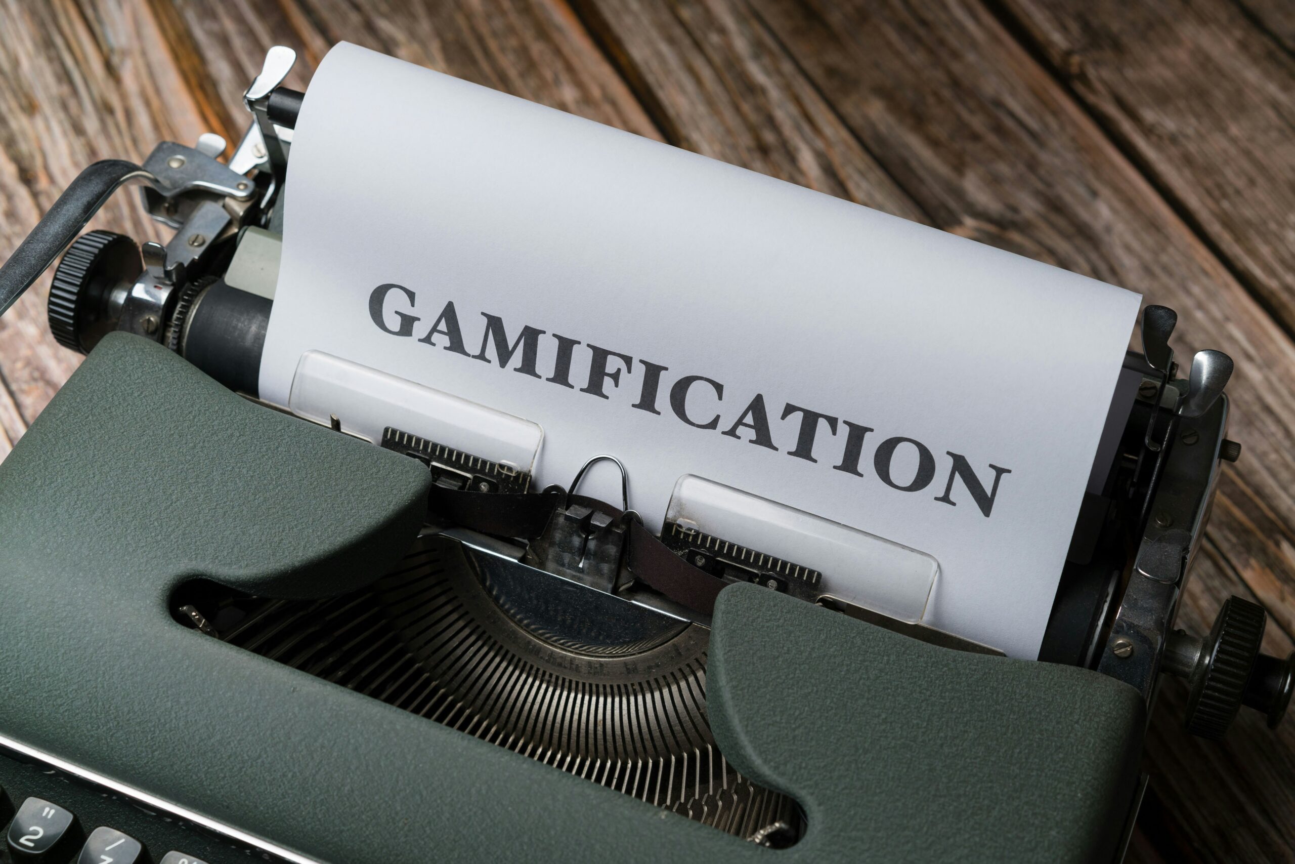 Typewriter with a sheet of paper reading Gamification